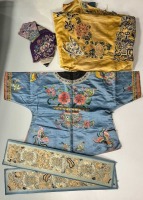 A Chinese child's blue silk embroidered jacket, early 20th century,