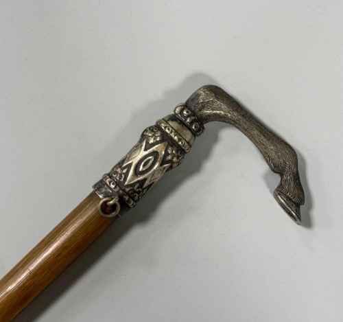 A rhino horn and silver coloured metal mounted riding crop, late 19th century,