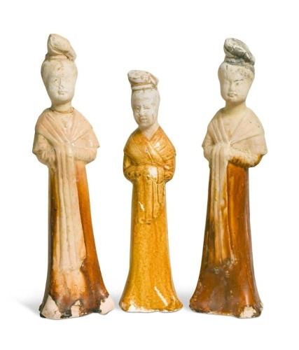 A group of four Chinese partly straw-glazed pottery lady court attendants, Tang Dynasty,