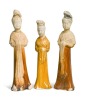 A group of four Chinese partly straw-glazed pottery lady court attendants, Tang Dynasty,