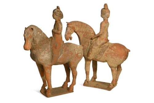Two Chinese terracotta horses with female riders, Tang Dynasty or later,