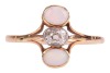 An old brilliant-cut diamond and opal dress ring, centred with an oval old-cut diamond with an approximate weight of 0.30ct, in millgrained collet flanked by two precious opal oval cabochons, between trifurcated shoulders leading to shank in yellow metal - 2
