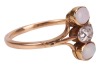An old brilliant-cut diamond and opal dress ring, centred with an oval old-cut diamond with an approximate weight of 0.30ct, in millgrained collet flanked by two precious opal oval cabochons, between trifurcated shoulders leading to shank in yellow metal - 3