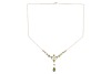 A gem-set lavalier necklace, set with seed pearls and garnet-topped doublets, in a yellow metal mount to a trace link chain with a hook clasp, surface tested as 9ct gold; 3.8 grams. Please note: Unless otherwise stated, lots have been tested using an elec - 2
