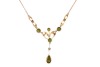 A gem-set lavalier necklace, set with seed pearls and garnet-topped doublets, in a yellow metal mount to a trace link chain with a hook clasp, surface tested as 9ct gold; 3.8 grams. Please note: Unless otherwise stated, lots have been tested using an elec - 3