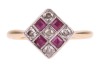 A ruby and diamond panel ring, the square ring head set with five round brilliant-cut diamonds, and four square table-cut rubies, in pierced floral gallery, between tapered shoulders to a D-profile shank, yellow metal stamped '18ct', ring head 1.2 cm wide - 2