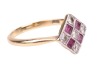 A ruby and diamond panel ring, the square ring head set with five round brilliant-cut diamonds, and four square table-cut rubies, in pierced floral gallery, between tapered shoulders to a D-profile shank, yellow metal stamped '18ct', ring head 1.2 cm wide - 3