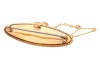A Victorian seed pearl brooch in 15ct yellow gold, of floral design, the elongated navette-shaped mount centred with a row of graduated split pearls, surround adorned with flower details, and a twisted rope border, brooch fittings to the back with replace - 2