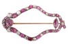 A ruby and diamond-set openwork navette brooch, composed of a row of alternating ruby and rose-cut diamonds (with four later-added synthetic rubies), of navette form, in cut-down white metal mounts, with two additional rubies set to the inside of the ruby