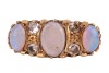 An opal and diamond-set half hoop ring, set with three precious opal cabochons, set between single-cut diamonds, in a yellow metal mount marked &lsquo;18ct&rsquo;, size L; 4.7 grams - 2