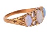 An opal and diamond-set half hoop ring, set with three precious opal cabochons, set between single-cut diamonds, in a yellow metal mount marked &lsquo;18ct&rsquo;, size L; 4.7 grams - 3