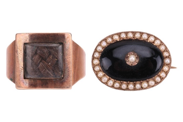 An early 19th century mourning ring, with plaited hair behind the central glass compartment, engraved to the interior: &lsquo;John Hinsum, 26 May, 1802, At 60&rsquo;, in a rose metal mount, surface tested as 9ct, size Q, together with a Victorian onyx and seed pearl 
