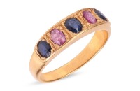 A five-stone sapphire ring, comprising three grain-set blue oval-cut sapphires interspersed with two grain-set oval-cut pink sapphires, in yellow metal surface testing as 18ct, size P, 6.0 grams. Please note: Unless otherwise stated, lots have been tested