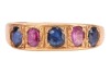 A five-stone sapphire ring, comprising three grain-set blue oval-cut sapphires interspersed with two grain-set oval-cut pink sapphires, in yellow metal surface testing as 18ct, size P, 6.0 grams. Please note: Unless otherwise stated, lots have been tested - 2