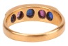 A five-stone sapphire ring, comprising three grain-set blue oval-cut sapphires interspersed with two grain-set oval-cut pink sapphires, in yellow metal surface testing as 18ct, size P, 6.0 grams. Please note: Unless otherwise stated, lots have been tested - 3