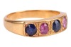 A five-stone sapphire ring, comprising three grain-set blue oval-cut sapphires interspersed with two grain-set oval-cut pink sapphires, in yellow metal surface testing as 18ct, size P, 6.0 grams. Please note: Unless otherwise stated, lots have been tested - 4