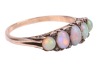 An opal-set half hoop ring; set with five precious opal cabochons, of graduated sizes, each displaying vivid play of colour on a light ground, accented with small polki diamonds, with one diamond deficit, the gallery of scroll design leading to an unmarke - 3