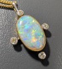 An opal-set pendant, composed of an oval-shaped precious opal cabochon, displaying strong spectral play of colour to a white background, measuring approximately 14mm x 9mm, in a bezel setting with millegrain detailing, accented by bezel-set old-cut diamon - 4