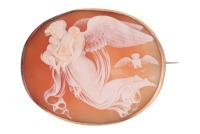 A shell cameo brooch, depicting Nyx, the Goddess of the Night, carrying her children along with an owl, in a conforming mount surface testing as 14ct, with later-added brooch fittings, 4.3 x 3.5 cm, 10.2 grams. Please note: Unless otherwise stated, lots h