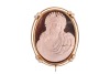 A hardstone cameo reliquary, the ferruginous quartz (or rhyolite?) relief-carved with the portrait of Jesus, set in an oval frame, intercardinal points adorned with brilliant-cut diamond accents, base deficient, unmarked yellow metal surface testing as 18