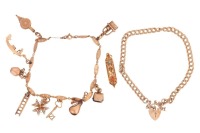 Two bracelets and a loose charm; comprising a charm bracelet with nine charms on engraved navette links, in yellow metal stamped '585', 19.5 cm; a 9ct gold double curb link chain with heart-shaped padlock clasp, 18.0 cm long; and a loose Mezuzah charm sta