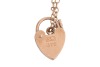 Two bracelets and a loose charm; comprising a charm bracelet with nine charms on engraved navette links, in yellow metal stamped '585', 19.5 cm; a 9ct gold double curb link chain with heart-shaped padlock clasp, 18.0 cm long; and a loose Mezuzah charm sta - 2