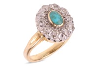 A turquoise and diamond cluster ring, centred with an oval turquoise cabochon in collet, encircled by ten old-cut diamonds, between grooved shoulders to D-profile shank, unmarked metal testing as 18ct, ring head 1.4 x 1.1 cm, size J, 4.2 grams. Please not