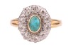 A turquoise and diamond cluster ring, centred with an oval turquoise cabochon in collet, encircled by ten old-cut diamonds, between grooved shoulders to D-profile shank, unmarked metal testing as 18ct, ring head 1.4 x 1.1 cm, size J, 4.2 grams. Please not - 2