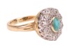 A turquoise and diamond cluster ring, centred with an oval turquoise cabochon in collet, encircled by ten old-cut diamonds, between grooved shoulders to D-profile shank, unmarked metal testing as 18ct, ring head 1.4 x 1.1 cm, size J, 4.2 grams. Please not - 3