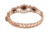 A hinged bracelet set with black star sapphires; the openwork scrolled mount with twisted rope border and beaded accents, set with three graduated oval black star sapphire cabochons, fastens with a tongue clasp with push-in thumbpiece, in yellow metal sta - 2