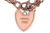 A panther link bracelet with padlock clasp, comprising nine rows of panther links, with textured decorations and slightly curved details, fastens with a heart-shaped padlock clasp with engraved floral scrollwork, marked '9ct', overall length 20.0 cm, 9.6 - 2