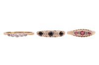 Three rings; comprising a diamond-set five-stone ring, with five graduated single-cut diamonds, in a yellow metal mount marked &lsquo;18ct&rsquo;, size O, a sapphire and diamond-set half hoop ring, in a 9ct yellow gold mount, size O, and a paste and diamond-set ring,