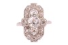 An early 20th-century diamond-set plaque ring; composed of three central bezel-set old-cut diamonds, the largest measuring approximately 6.1mm with an estimated carat weight of 0.85ct, flanked by two old-cut diamonds measuring approximately 3mm each, in a - 2