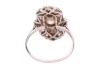An early 20th-century diamond-set plaque ring; composed of three central bezel-set old-cut diamonds, the largest measuring approximately 6.1mm with an estimated carat weight of 0.85ct, flanked by two old-cut diamonds measuring approximately 3mm each, in a - 4