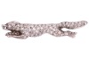 A diamond-set fox brooch, sculpted as a running fox, fully encrusted with single-cut diamonds, with a ruby cabochon as eye, later brooch fittings to the reverse, unmarked white metal surface testing as 18ct, 4.0 cm wide, 4.1 grams. Please note: Unless oth