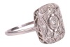 An Art Deco style panel ring, centrally-set with a bezel-set round brilliant diamond, within a diamond-set openwork panel, to a white metal shank marked &lsquo;plat&rsquo;, size N; 3.3 grams. - 4