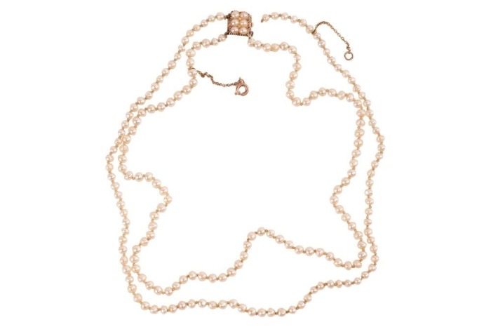 A double-row natural saltwater pearl necklace, comprising two strands of off-round pearls, with an average 3.5 mm in diameter, hand-knotted to a box clasp encrusted with split pearls, unmarked pink coloured metal surface testing as 14ct, overall length 38