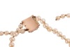 A double-row natural saltwater pearl necklace, comprising two strands of off-round pearls, with an average 3.5 mm in diameter, hand-knotted to a box clasp encrusted with split pearls, unmarked pink coloured metal surface testing as 14ct, overall length 38 - 3