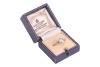 A diamond solitaire ring, the central diamond measuring approximately 7.5mm, with an estimated carat weight of 1.70ct, flanked by two bezel-set baguette-cut diamonds, in a bi-colour metal mount marked &lsquo;18ct&rsquo;, size L; 3.8 grams. - 5