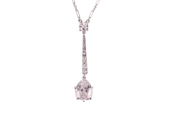 A French Belle &Eacute;poque old-cut diamond lavalier necklace, with an estimated total diamond weight of 2.50ct, consisting of a pear-shaped old-cut diamond in claw-setting, suspending from a tapered and articulated bar with millgrain details set with a row of 