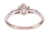 A diamond-set ring, composed of an old European cut diamond in a six-prong setting, measuring approximately 5.7mm with an estimated carat weight of 0.70ct, flanked by two tapered baguette-cut diamonds, to an 18ct white gold mount, size L; 2.5 grams - 3