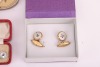 A matched gold, mother-of-pearl and sapphire dress set, in fitted case; together with a pair of silver, mother-of-pearl and enamel cufflinks, adapted from buttons, with later links; two sets of six gilt metal and enamel buttons in fitted cases, circa 1910 - 7