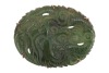 A mottled dark green nephrite jade panel brooch, the oval plaque carved with a sinuous dragon in cloud scrolls, in a plain 9ct yellow gold brooch frame, hallmarked for London 1975, 45mm x 33mm, 13.3g gross.