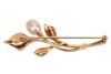 A pearl-set spray brooch, the stylised flowerheads with a sandblast finish, mounted with a potato-shaped cultured pearl of 7.4 mm, stem finial flush-set with a round brilliant-cut diamond accent, brooch fittings to the reverse, yellow metal stamped '750', - 2
