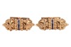 A pair of Etruscan-style cufflinks, of hollow scroll holder form, with twisted cable and granulated details, accentuated with a line of navy enamel at the centre, toggle fittings with personal inscription, in yellow metal stamped 'K18', 2.8 cm wide, 18.5 - 4