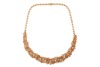 An emerald and diamond parure; comprising a necklace, a bracelet, a pair of earrings and a cocktail ring; of textured and braided design, embellished with lines of graduated circular-cut emeralds, and round brilliant-cut diamond clusters; the collar neckl - 3