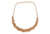 An emerald and diamond parure; comprising a necklace, a bracelet, a pair of earrings and a cocktail ring; of textured and braided design, embellished with lines of graduated circular-cut emeralds, and round brilliant-cut diamond clusters; the collar neckl - 4
