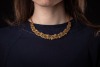 An emerald and diamond parure; comprising a necklace, a bracelet, a pair of earrings and a cocktail ring; of textured and braided design, embellished with lines of graduated circular-cut emeralds, and round brilliant-cut diamond clusters; the collar neckl - 13