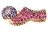 Attributed to Paul Flato - A gem-set slipper fur clip, in the form of a babouche with pom pom, the shoe bead-set with circular-cut rubies throughout with a rose-cut diamond border, with a pom pom centred with a rose-cut diamond and circular-cut sapphires,