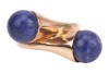 Gucci- a lapis lazuli cross-over ring in 9ct yellow gold, featuring two spherical lapis lazuli bead finials of 8.0 mm, mounted to the tapered bypass shoulders, leading to a D-profile shank, London 1976, sponsor's mark 'FJLd', size E, in original Gucci rin - 2